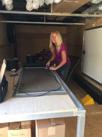 Connie fixing window screens